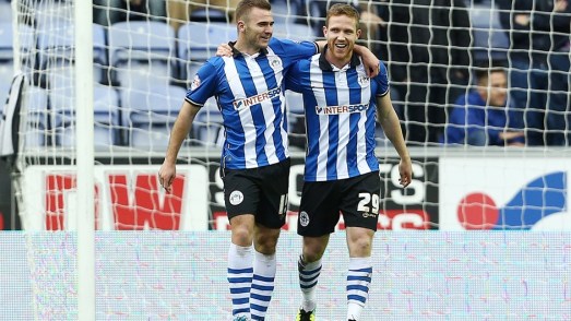 Adam Forshaw is congratulated after his penalty.  Photo courtesy of Fulham FC.